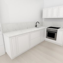 Sylwestri Usługi remontowo-budowlane - Jasna kuchnia z białymi, frezowanymi frontami szafek, marmurowym blatem i czarną armaturą. Widoczny piekarnik i płyta grzewcza. Minimalistyczny design.