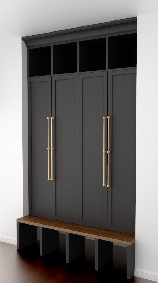 Wnękowa szafa w kolorze grafitowym z siedziskiem z drewna i złotymi, podwójnymi uchwytami, w minimalistycznym wnętrzu.