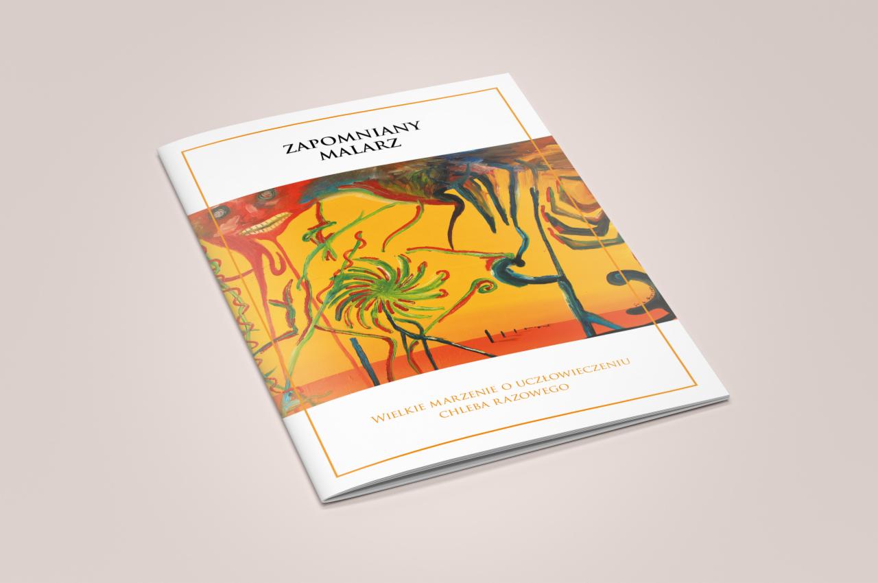 Katalog z abstrakcyjną grafiką na okładce, tytuł 'Zapomniany Malarz' i podtytuł 'Wielkie Marzenie o uczłowieczeniu Chleba Razowego', leżący pod kątem na gładkim tle.