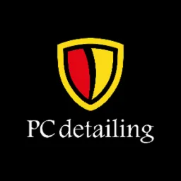 Logo firmy PC detailing przedstawiające stylizowaną tarczę w kolorach czerwonym i żółtym na czarnym tle.