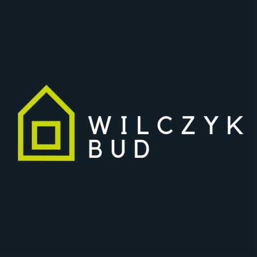 Logo firmy budowlanej WILCZYK BUD z ikoną domu w kolorze limonkowym na ciemnym tle.
