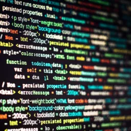 Ekran monitora z wyświetlonym kodem HTML, widoczne fragmenty: 'font-weight', 'background-color', 'errorMessage', 'todoitem', w Olsztynie.