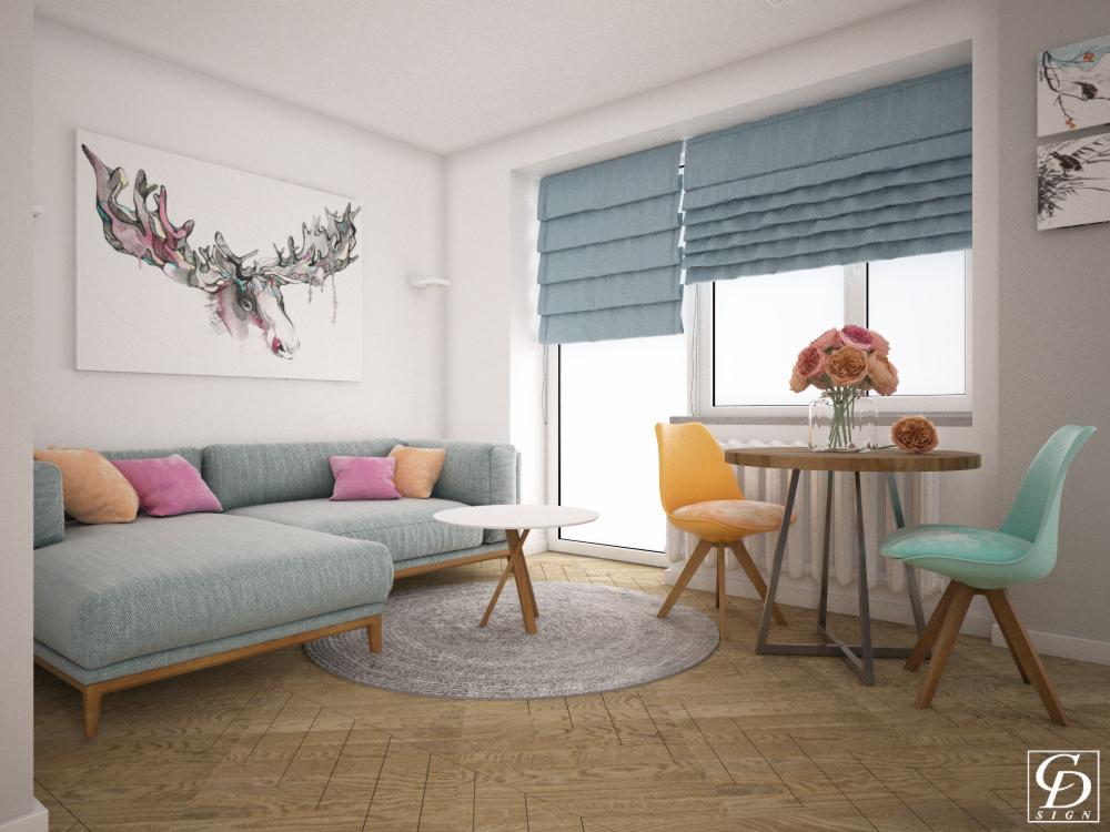 Jasny salon z narożną sofą w odcieniach szarości, okrągłym stolikiem kawowym i jadalnianym, krzesłami w kolorach żółtym i turkusowym oraz roletami rzymskimi w pastelowym odcieniu niebieskiego.