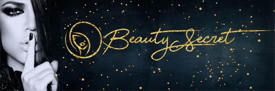 Kobieta z palcem na ustach, czarno-białe zdjęcie z elementami graficznymi w kolorze złotym, napis Beauty Secret oraz logo.