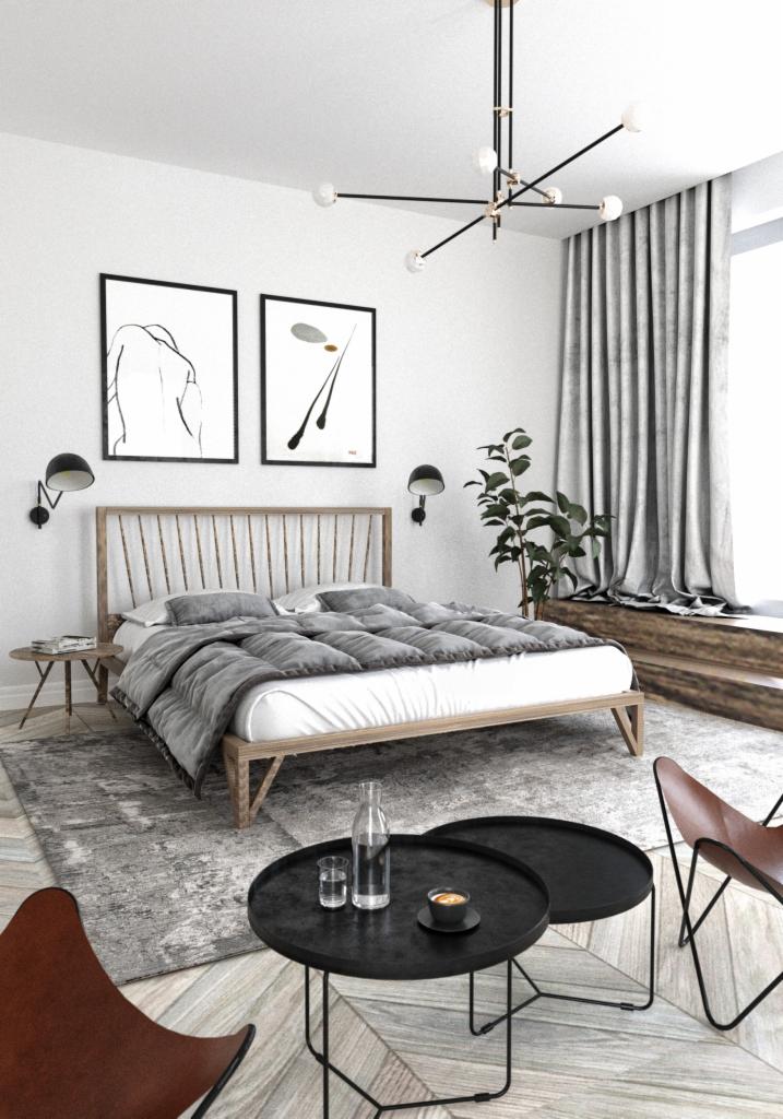 Jasna sypialnia z drewnianym łóżkiem, szarą pościelą i abstrakcyjnymi obrazami na ścianie. Dwa czarne stoliki kawowe z napojami i brązowe krzesło motylkowe. Nowoczesna lampa sufitowa.