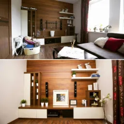 Salon z drewnianą ścianą, białymi półkami i szafkami, dekoracjami, kanapą i zasłonami w kwiaty, uchwycony z dwóch różnych perspektyw.