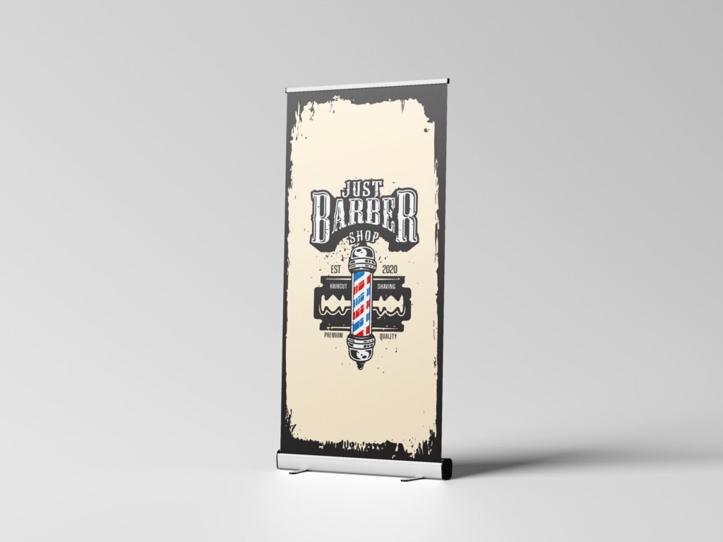 Roll-up z grafiką w stylu vintage dla barber shopu, prezentujący logo z motywem fryzjerskim i hasłem 'Just Barber Shop'.