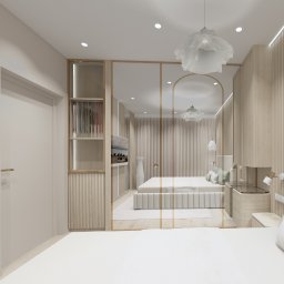 Dolecińska Projekt DARIA DOLECIŃSKA - Jasna sypialnia z drewnianymi panelami, garderobą i lustrem tworzącym iluzję głębi. Minimalistyczny design z akcentami złota i dekoracyjnym oświetleniem.