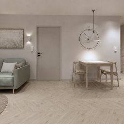 Dolecińska Projekt DARIA DOLECIŃSKA - Jasne wnętrze z miętową sofą, drewnianym stolikiem kawowym i jadalnianym, podłogą w jodełkę oraz zabudową przedpokoju z tapicerowaną ławką.