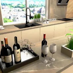 Nowoczesna kuchnia w beżach z marmurowym blatem, ekspres do kawy, wino i kieliszki na tacy, zioła w doniczkach, widok na miasto za oknem.