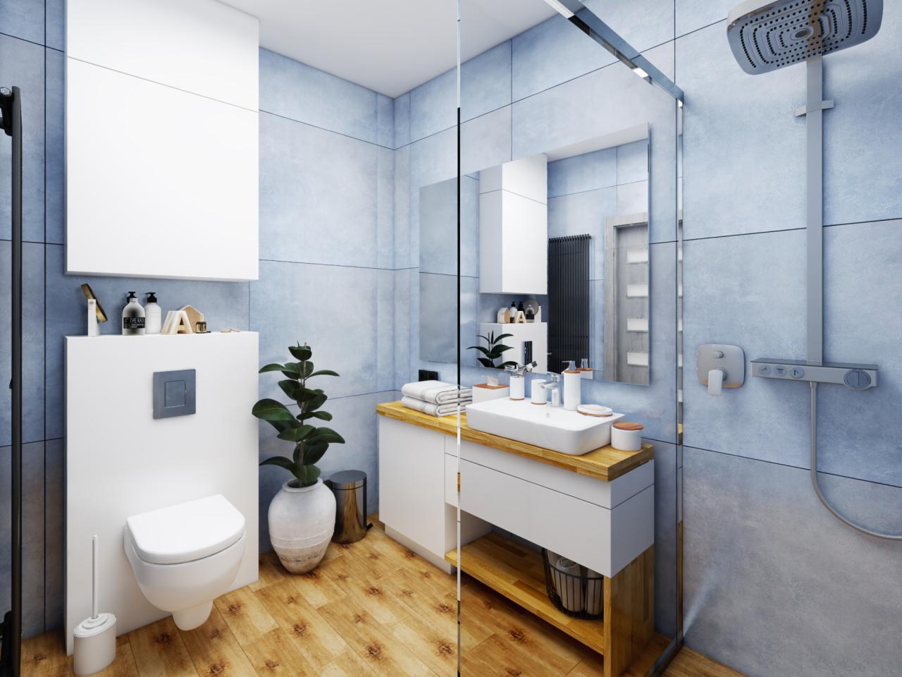Nowoczesna łazienka z błękitnymi płytkami, drewnianą podłogą i blatem, białą szafką umywalkową z otwartą półką, toaletą podwieszaną i szklanym prysznicem walk-in.