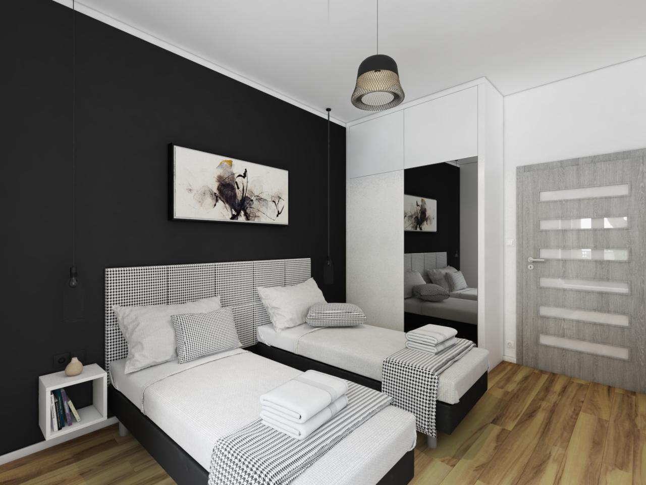 Nowoczesna aranżacja sypialni w Poznaniu z dwoma pojedynczymi łóżkami z wezgłowiami w pepitkę, czarną ścianą z abstrakcyjnym obrazem i drewnianą podłogą, widok z perspektywy drzwi.