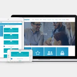 Responsywna strona internetowa wyświetlana na laptopie, tablecie i smartfonie, prezentująca ofertę usług firmy z nagłówkiem z uśmiechniętymi pracownikami.