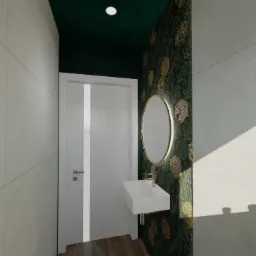 Wizualizacja małej łazienki z umywalką nablatową, okrągłym lustrem w złotej ramie i zieloną ścianą w geometryczne wzory, oświetlona punktowo, z drewnianą podłogą.