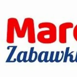 Logo firmy Marcyś Zabawki z elementem puzzla z uśmiechniętą buzią w kolorze zielonym, nazwa firmy w kolorze czerwonym i dopisek zabawki w kolorze niebieskim.