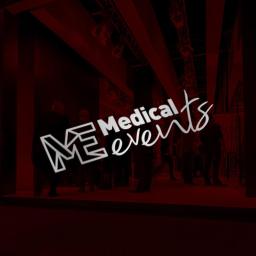 Designers Agencja Multimedialna K. Malinowski - Iluminowane logo Medical Events na tle sceny z oświetleniem i sylwetkami ludzi w tle, dominująca czerwień.