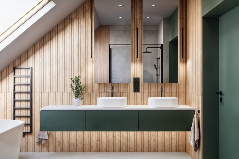 Stylowa łazienka na poddaszu z drewnianą boazerią, dwoma umywalkami nablatowymi i zieloną szafką. W lustrach odbija się kabina prysznicowa.