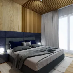 Nowoczesna sypialnia z drewnianymi panelami ściennymi, tapicerowanym zagłówkiem w odcieniach granatu i szarości, oraz nocnymi lampkami kulami.