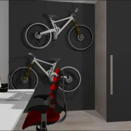 Wizualizacja biura z dwoma rowerami górskimi zawieszonymi na ciemnoszarej ścianie, białe biurko z komputerem i czerwone krzesło biurowe