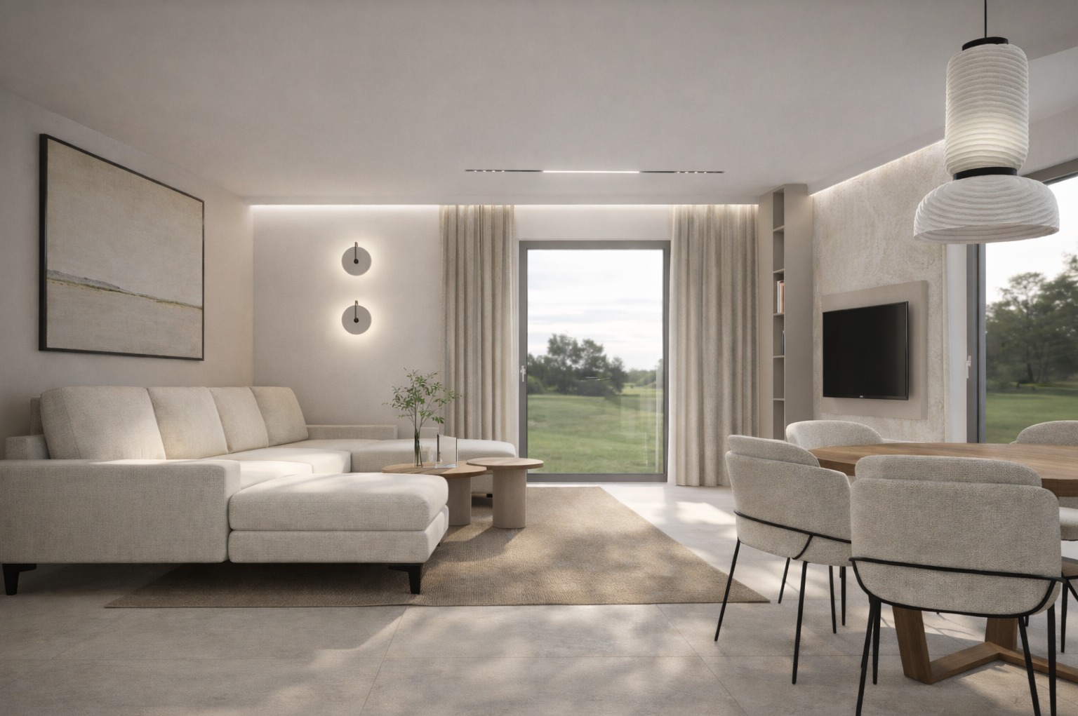 Jasny salon z narożną sofą, okrągłym stolikiem kawowym i widokiem na zieleń za oknem. Minimalistyczne lampy ścienne i duży obraz na ścianie. Stonowana kolorystyka.