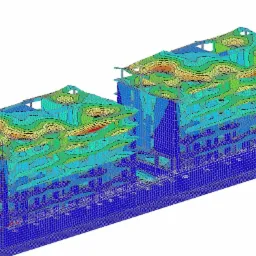 Wizualizacja 3D przemieszczeń w konstrukcji budynku, prezentująca analizę odkształceń z użyciem kolorowej mapy konturowej.