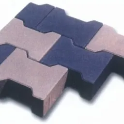 Ułożone obok siebie kostki brukowe typu 'kość' w kolorach szarym i grafitowym, tworzące wzór zygzaka.