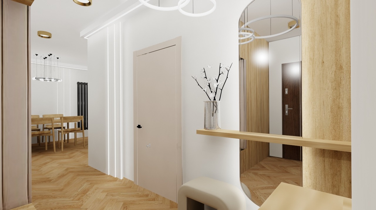 Nowoczesny przedpokój z lustrem w drewnianej ramie, parkietem w jodełkę i minimalistycznym oświetleniem. W tle widoczna jadalnia z drewnianym stołem i krzesłami.