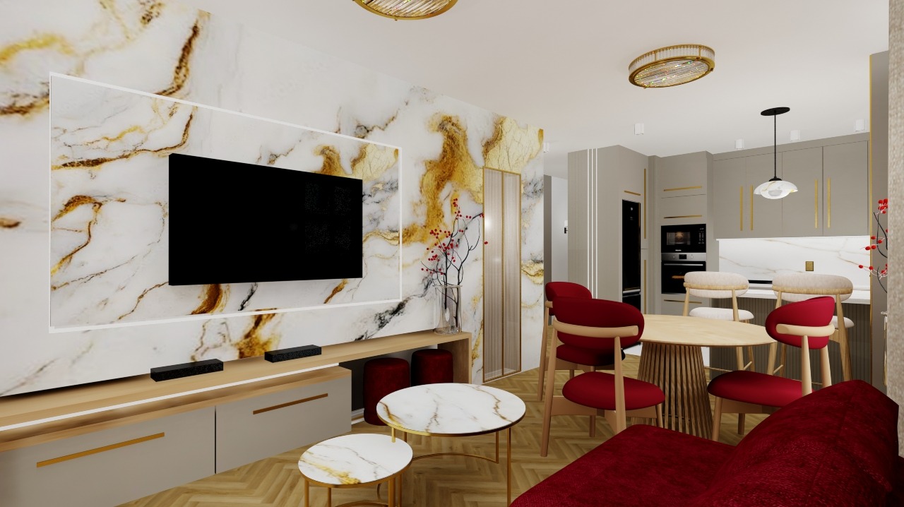 Wnętrze mieszkania w odcieniach pudrowego różu i szarości. Marmurowa ściana z telewizorem, okrągły stół z krzesłami i bordowa sofa. Złote akcenty w oświetleniu i meblach.