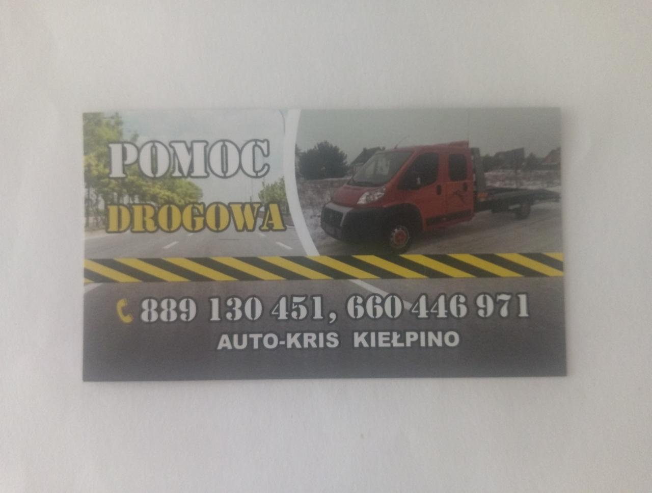 Wizytówka firmy AUTO-KRIS Kiełpino z numerami telefonów i grafiką czerwonego pojazdu do holowania pojazdów.