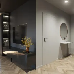 Nowoczesne wnętrze: ciemna ściana z telewizorem i kwiatami w wazonie, jasna ściana z owalnym lustrem i konsolą, parkiet w jodełkę.