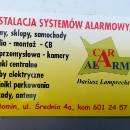 Wizytówka firmy oferującej instalację systemów alarmowych do domów, sklepów i samochodów, a także montaż radia CB i TV przemysłowej.