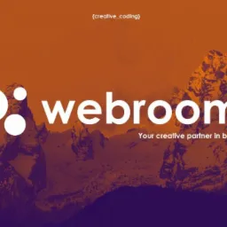 Logo firmy Webroom z trzema białymi okręgami i napisem na tle górskiego krajobrazu w odcieniach pomarańczu i fioletu, z hasłem 'Your creative partner in business'.