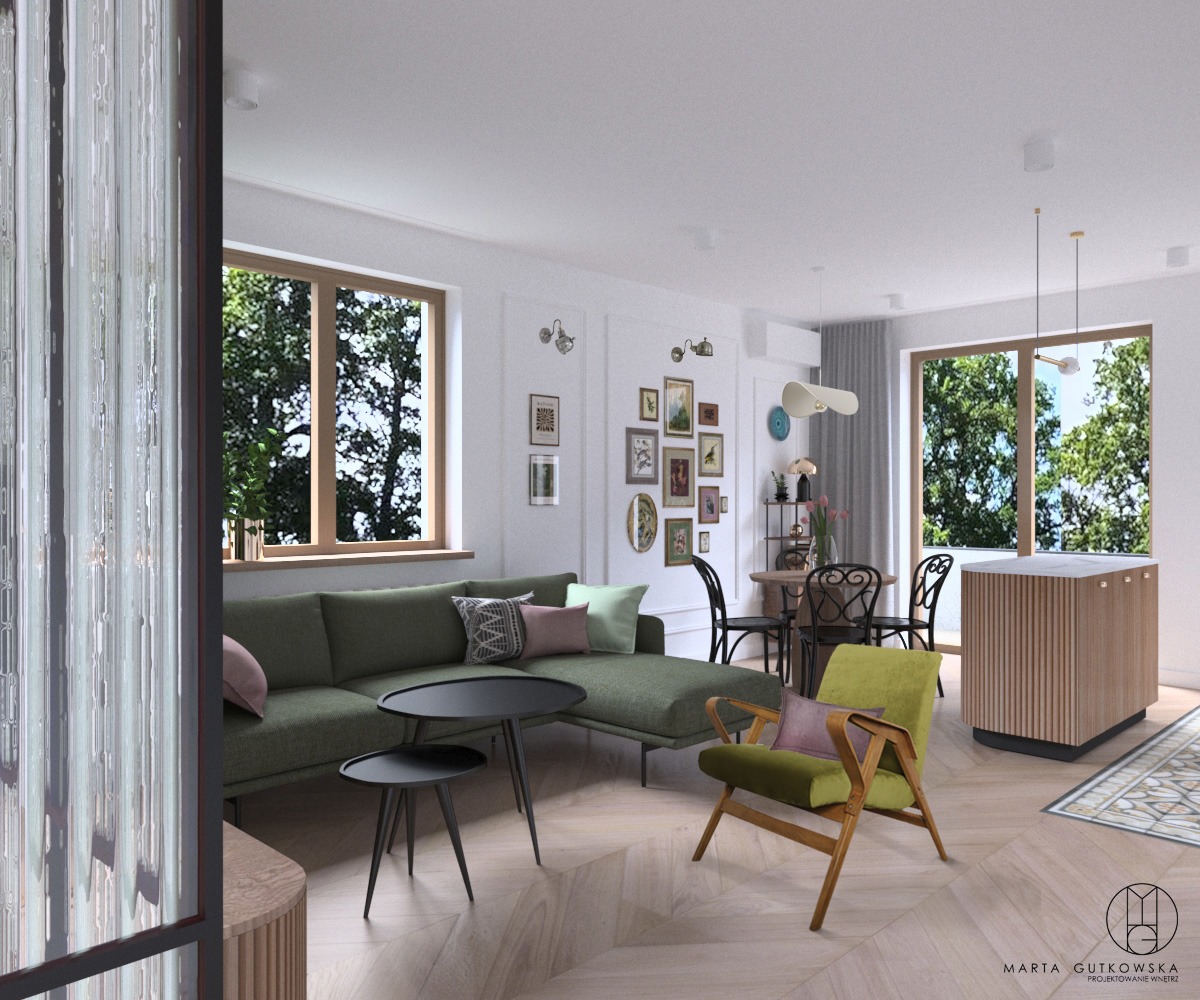 Wizualizacja przestronnego salonu w Grodzisku Mazowieckim z zieloną sofą narożną, okrągłymi stolikami kawowymi, drewnianym fotelem i galerią obrazów na ścianie, widok na jadalnię i kuchnię z wyspą.