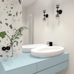 Wizualizacja nowoczesnej łazienki z podwójną, owalną umywalką nablatową na błękitnej szafce, ozdobiona roślinami w szklanym wazonie i oświetleniem ściennym w formie czarnych kul z przezroczystymi...