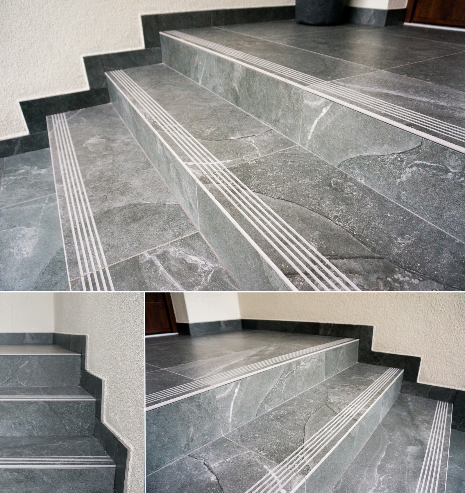 Wykończone schody z szarych płytek z antypoślizgowymi listwami w kolorze białym, widoczne fragmenty ściany i podłogi.