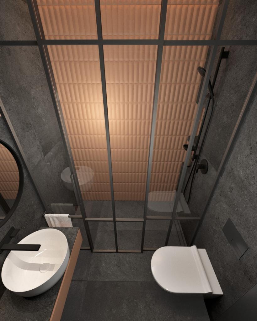 Nowoczesna łazienka z kabiną prysznicową typu walk-in, umywalką nablatową na blacie z akcentami miedzianymi i szarą armaturą.