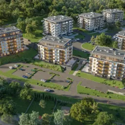 Wizualizacja osiedla mieszkaniowego z kilkoma nowoczesnymi, wielopiętrowymi budynkami apartamentowymi, otoczonymi zielenią i parkingami z samochodami, z lotu ptaka.