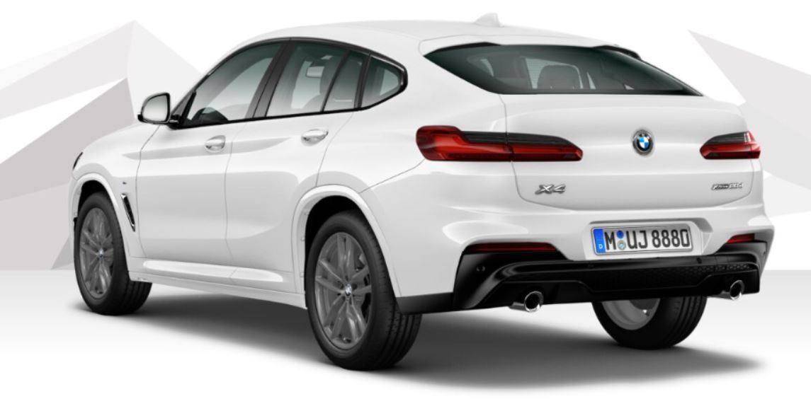 Biały samochód typu SUV coupé, widok z tyłu, z widocznymi detalami karoserii i tablicą rejestracyjną M UJ 8880.