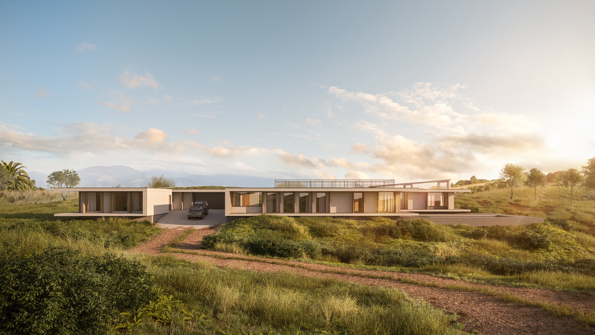 Nowoczesny, parterowy dom z płaskim dachem, otoczony bujną roślinnością i pagórkami, z samochodem zaparkowanym w garażu, widok z dołu na tle zachodzącego słońca.