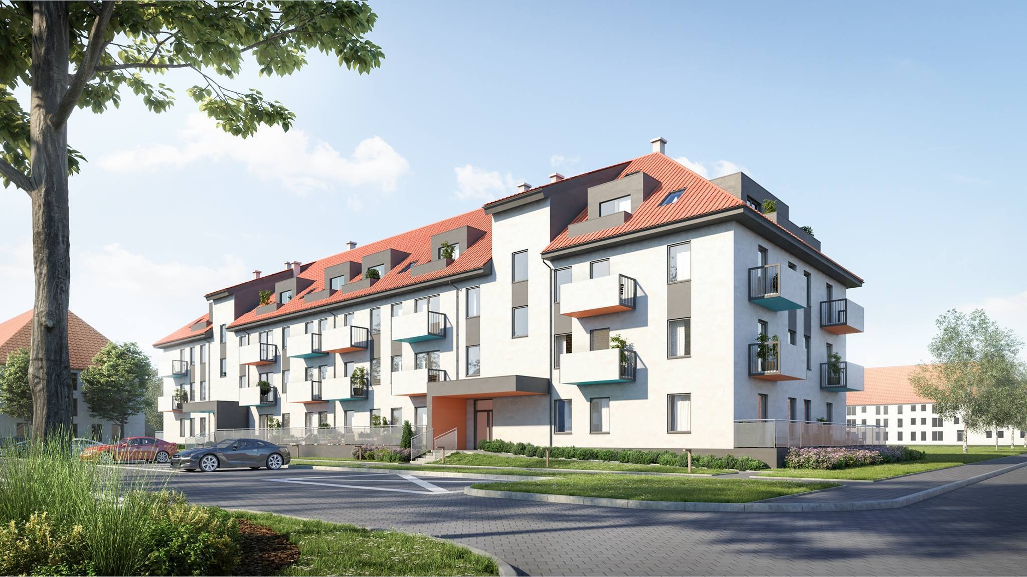 Wizualizacja budynku wielorodzinnego z balkonami w kolorach turkusowym i pomarańczowym, czerwony dach, szare elementy elewacji, samochody na parkingu, zieleń wokół budynku.