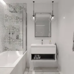 Nowoczesna łazienka z białą wanną, kabiną prysznicową, umywalką na szafce, lustrem, wiszącymi lampami i szarymi ręcznikami, wykończona płytkami w geometryczne i kwiatowe wzory.