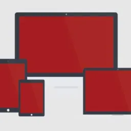 Rzut izometryczny przedstawiający responsywny design na różnych urządzeniach (smartfon, tablet, laptop, monitor) z jednolitym, czerwonym wypełnieniem ekranów, wykonany we Wrocławiu.