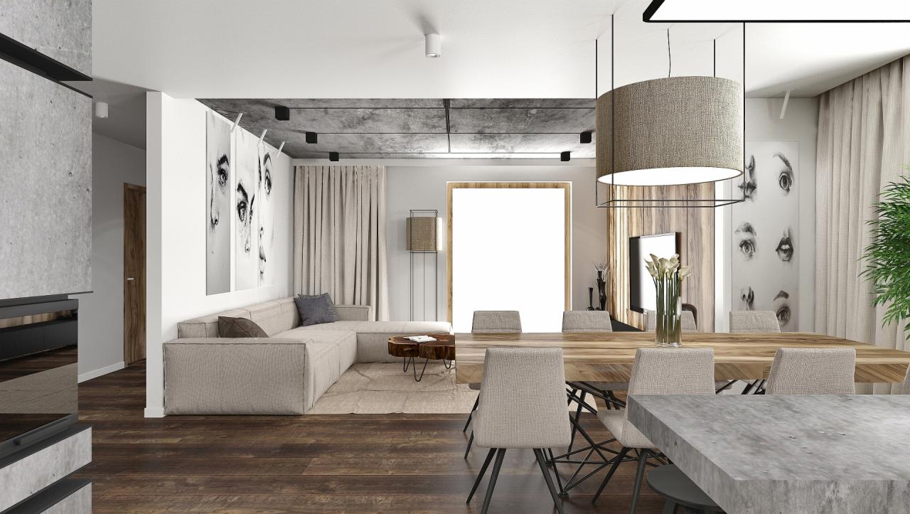 Wnętrze salonu z jadalnią w neutralnej kolorystyce: narożna sofa, drewniany stół z krzesłami, betonowy sufit z oświetleniem punktowym, grafiki na ścianach.