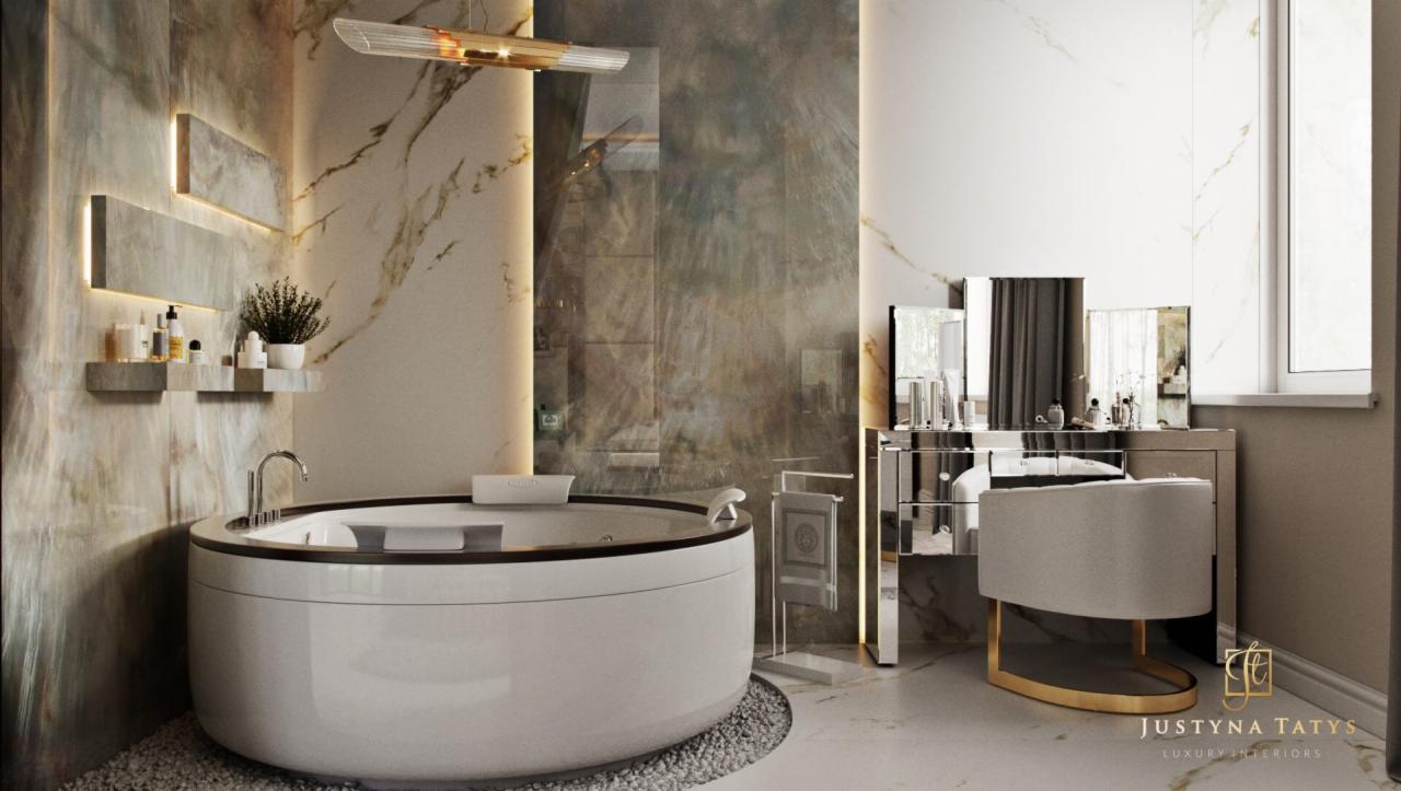 Elegancka łazienka z okrągłą wanną na kamiennym podłożu, podświetlane półki z kosmetykami i toaletka z lustrami w stylu glamour.