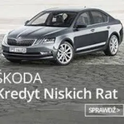 Szary samochód marki Skoda na tle szarego, piaszczystego podłoża. Na pierwszym planie napis 'ŠKODA Kredyt Niskich Rat' oraz przycisk 'SPRAWDŹ >'.
