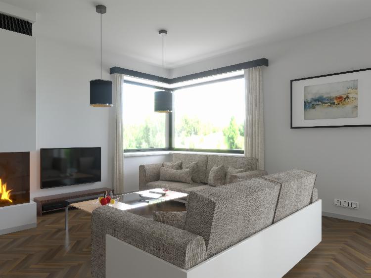 Wizualizacja przestronnego salonu z kominkiem, dwoma sofami w odcieniach szarości, stolikiem kawowym z owocami i szklankami oraz dużym oknem z widokiem na zieleń.