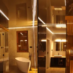 Nowoczesna łazienka z sauną, podświetleniem LED i marmurowymi akcentami, widok z różnych perspektyw.