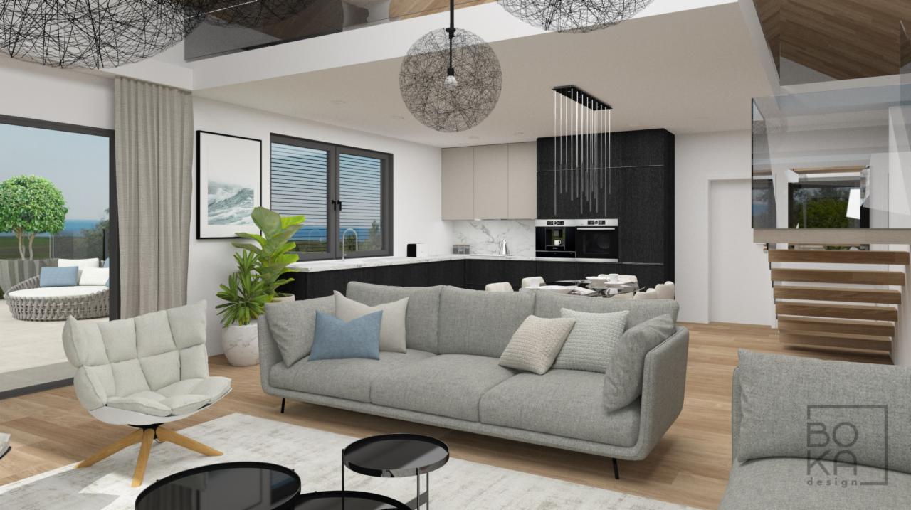 Wizualizacja przestronnego salonu z szarą sofą, krzesłem obrotowym, czarnymi stolikami kawowymi i widokiem na taras z okrągłą sofą, z kuchnią w tle z czarnymi i białymi szafkami oraz wiszącymi...