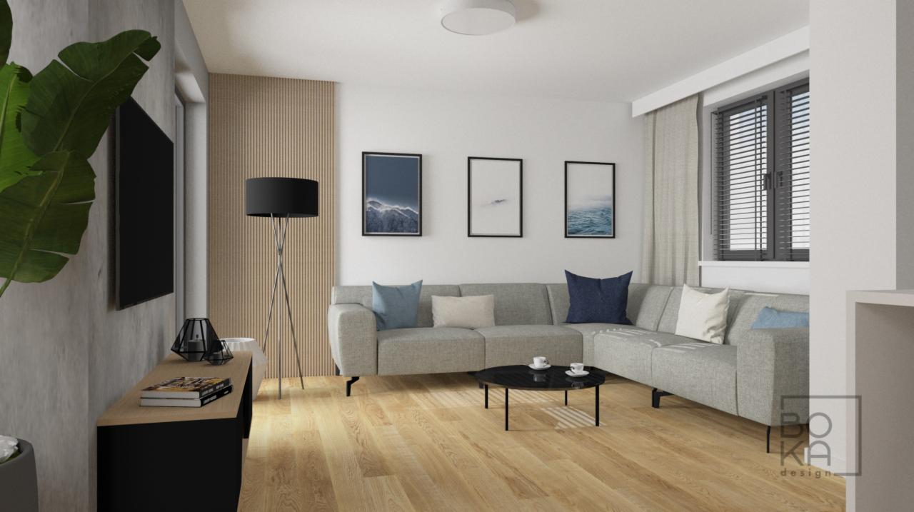 Wizualizacja salonu z szarą sofą narożną, czarnym stolikiem kawowym z dwoma filiżankami, telewizorem na ścianie z betonową fakturą, drewnianą podłogą i trzema obrazami nad sofą.