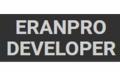 Czarny szyld z białym napisem 'ERANPRO DEVELOPER' w zbliżeniu.